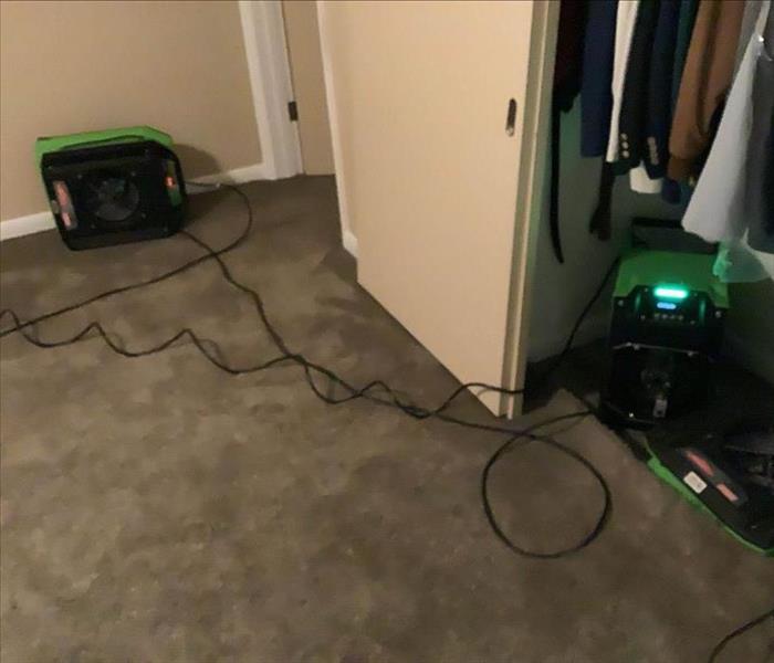 Air movers drying out room.
